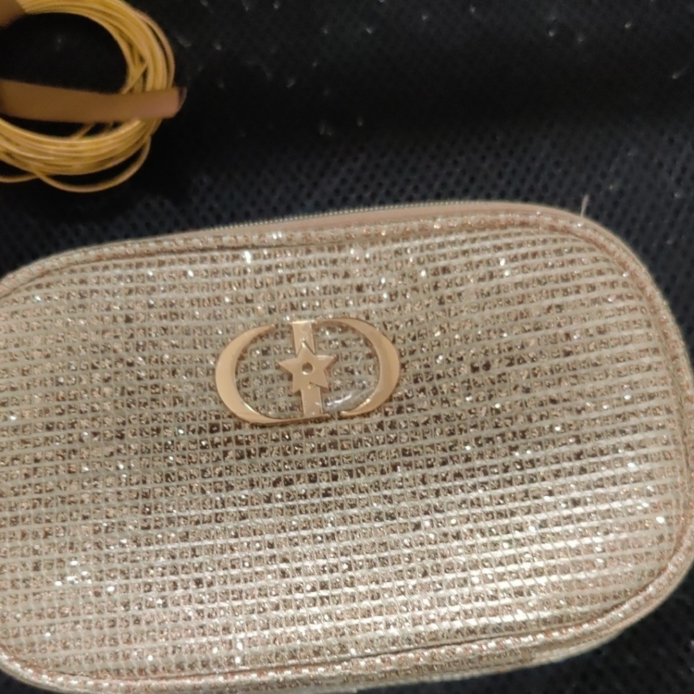 Shimmering Christin Doir Gold Clutch with Star Emblem